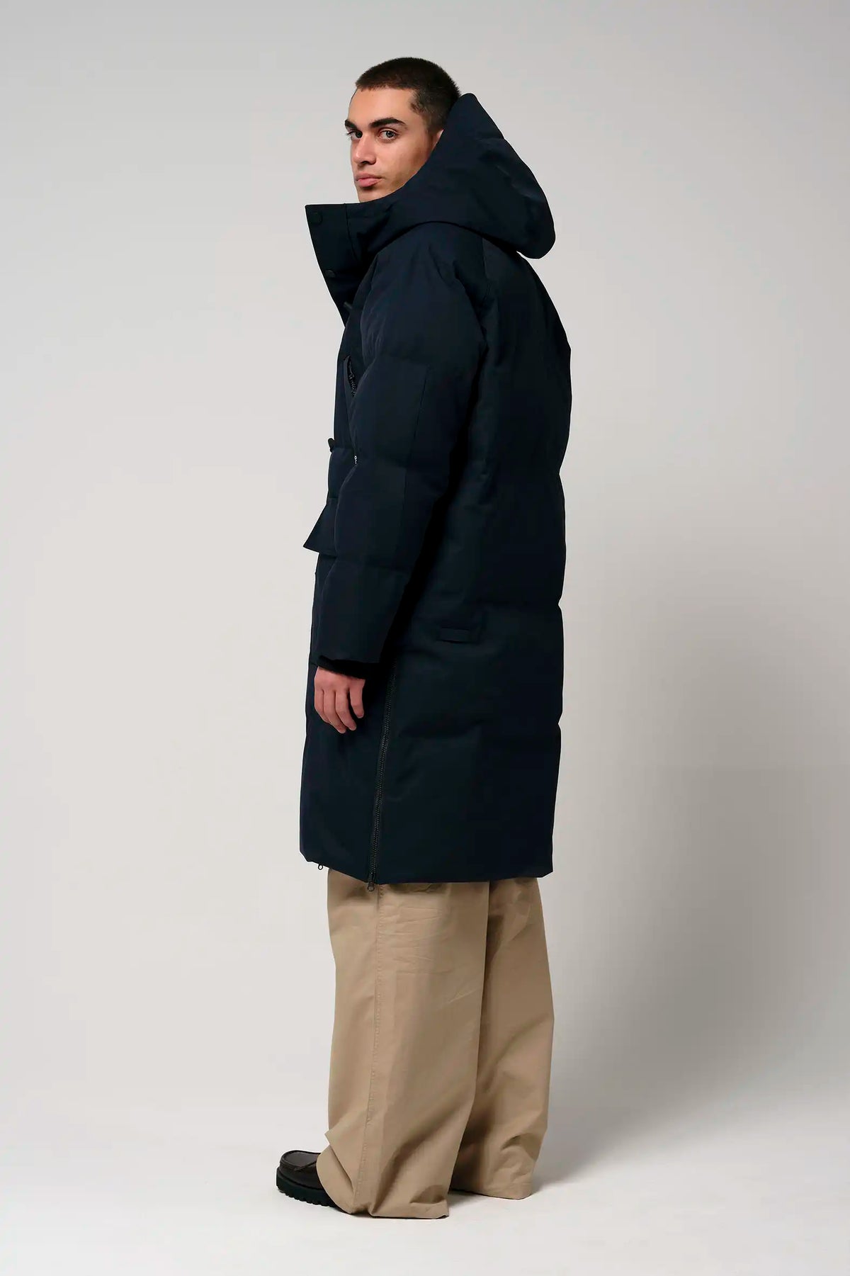 Barack Sky Captain Blue Parka worn by a model showcasing the back view, featuring a hood and adjustable design.