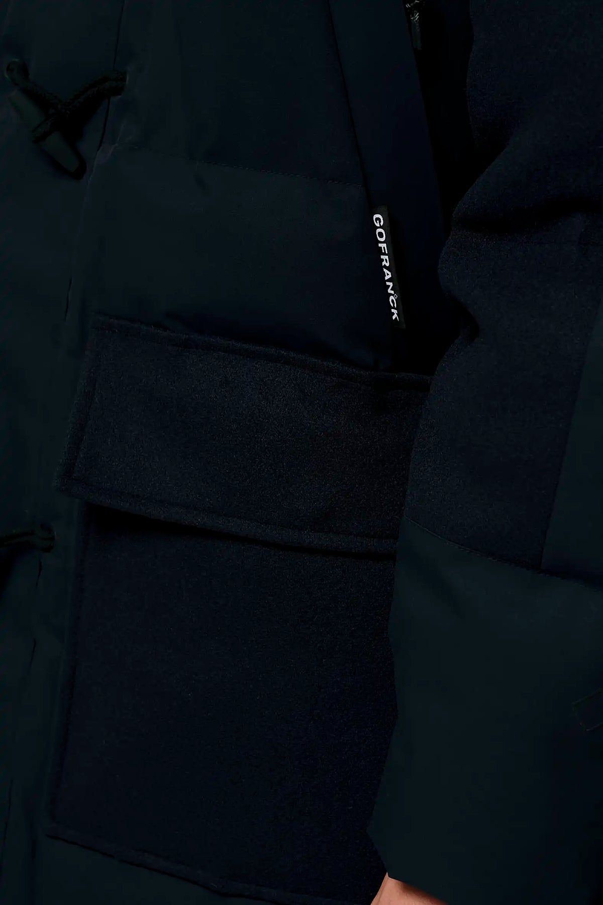 Barack Sky Captain Blue Parka showing close-up of the sleeve detail and pocket design.