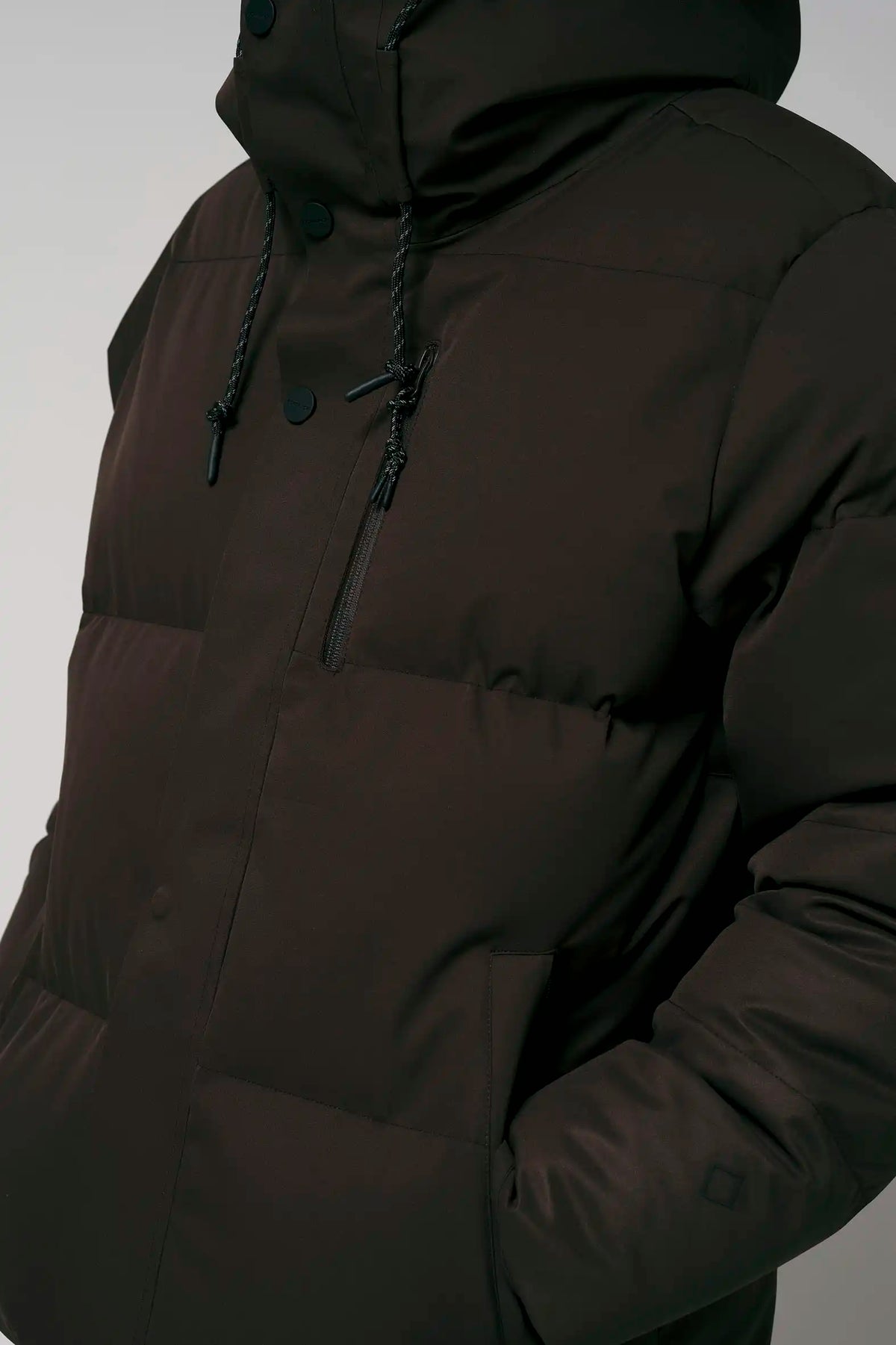 Bayu Black Coffee Coat features waterproof, breathable design with windproof protection and padded insulation.