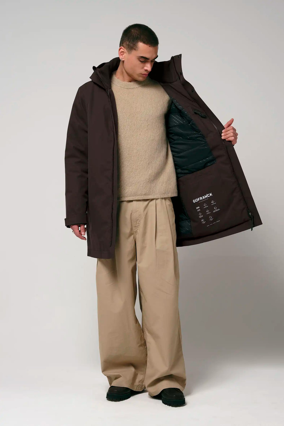 Cielo Black Coffee Coat worn by a model, showcasing waterproof and breathable features in a stylish design.