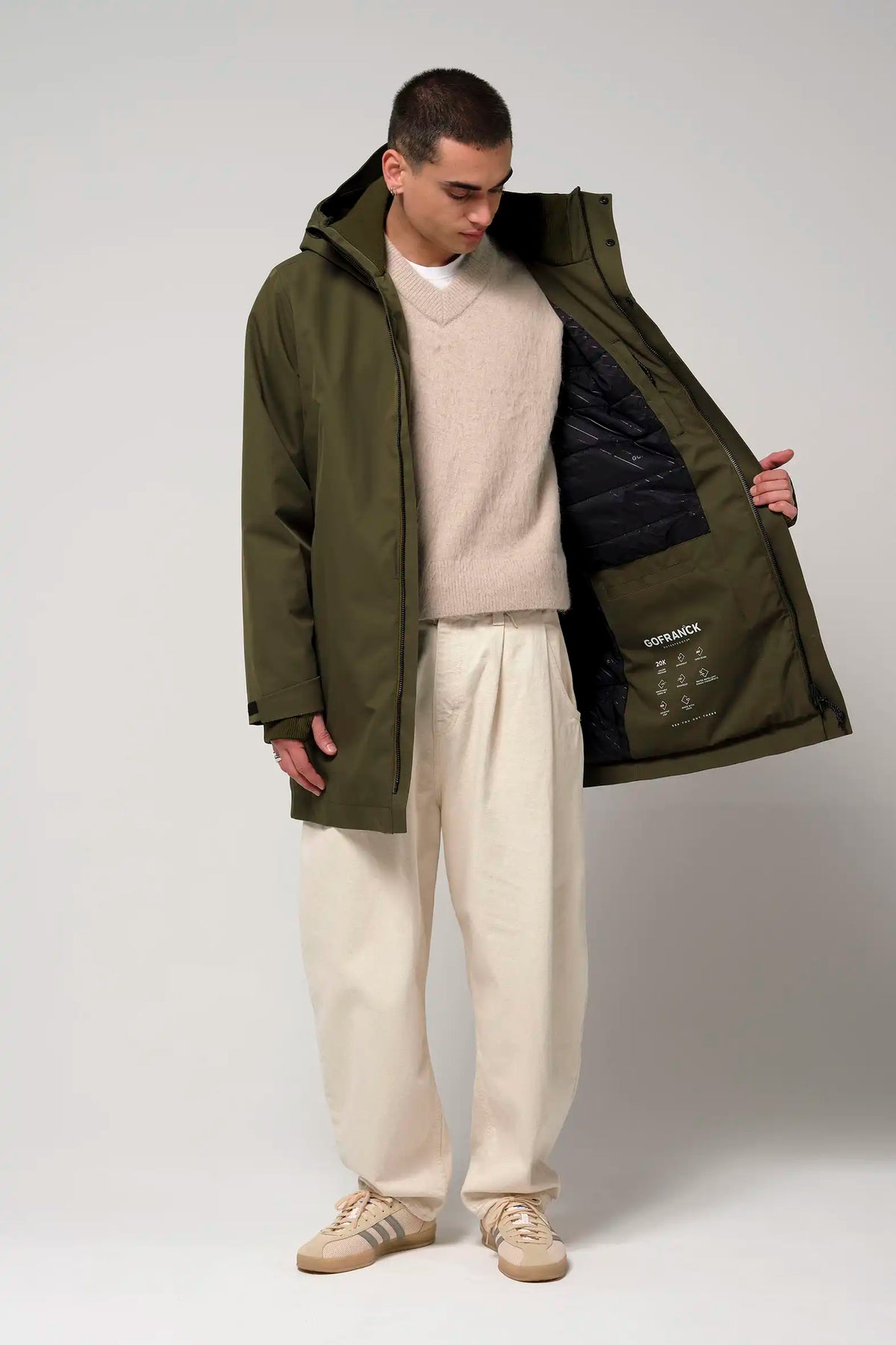 Cielo Dark Olive Green Coat worn by a model, showcasing its waterproof and stylish design.