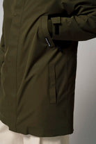 Cielo Dark Olive Green Coat detail showing waterproof fabric and stylish design features.