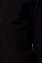 Claud Deep Black Coat showcasing its waterproof and windproof features with fully taped seams.