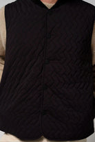 Claud Deep Black Coat, a stylish garment featuring a quilted design for warmth and comfort in cooler seasons.