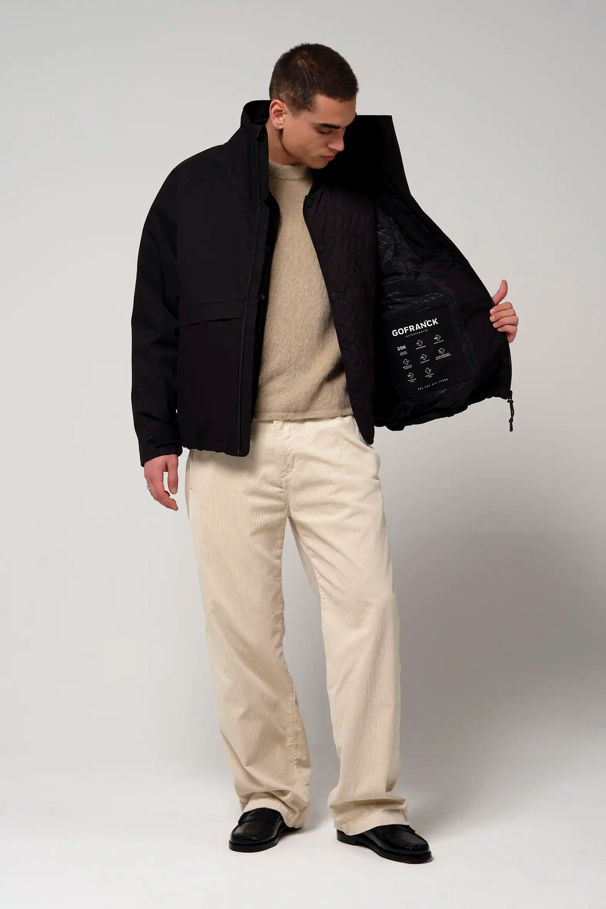 Model wearing the Claud Deep Black Coat with the inner jacket visible, showcasing its stylish design.