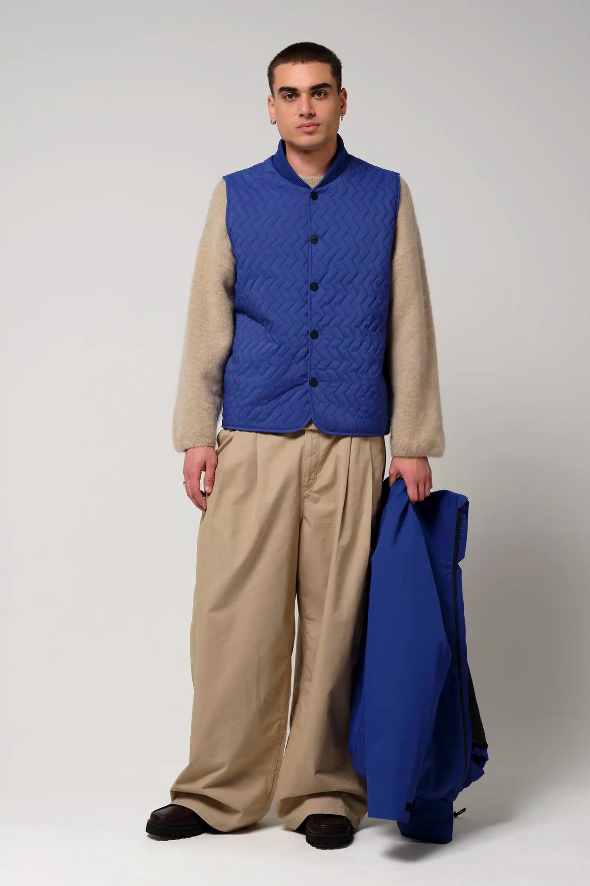 Model wearing Claud Sodalite Blue Coat, showcasing its stylish design and functionality.