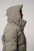 Climate Timber Wolf Grey Coat side view with hood, showcasing waterproof and windproof features.
