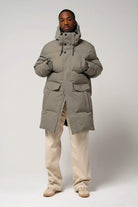 Model wearing the Climate Timber Wolf Grey Coat, highlighting its waterproof and breathable design.