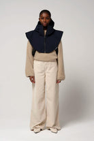 Gale Sky Captain Blue Parka worn with a beige sweater and light pants against a neutral background.