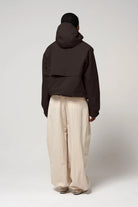 Guthrie Black Coffee Coat displayed from the back, highlighting its adjustable hood and sleek design.