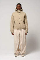 Guthrie Fields of Rye Beige Coat worn by model, showcasing waterproof, breathable, and windproof features.