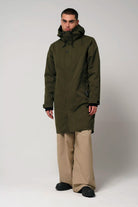 Raiden Dark Olive Green Parka model wearing waterproof and windproof outdoor jacket.
