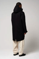Raiden Deep Black Parka viewed from the back, showcasing its sleek design and adjustable hood.