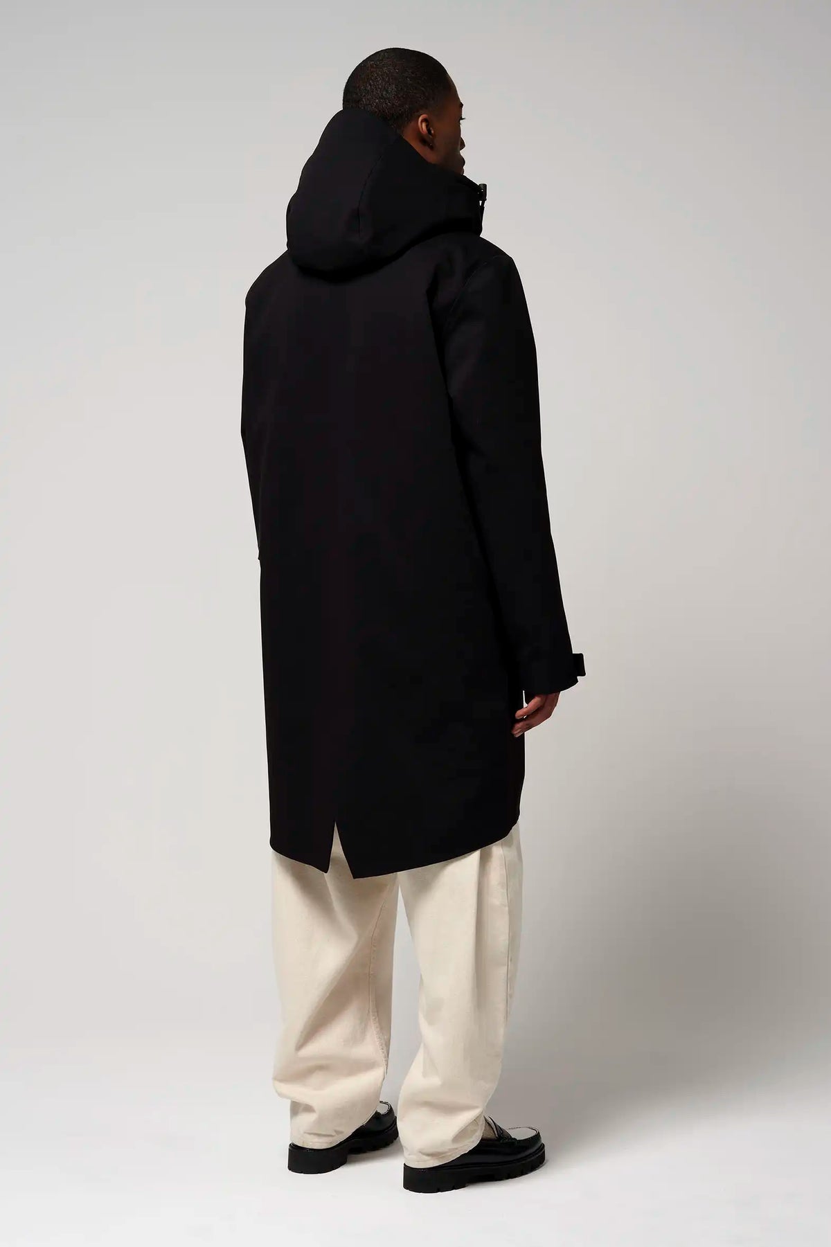 Raiden Deep Black Parka viewed from the back, showcasing its sleek design and adjustable hood.