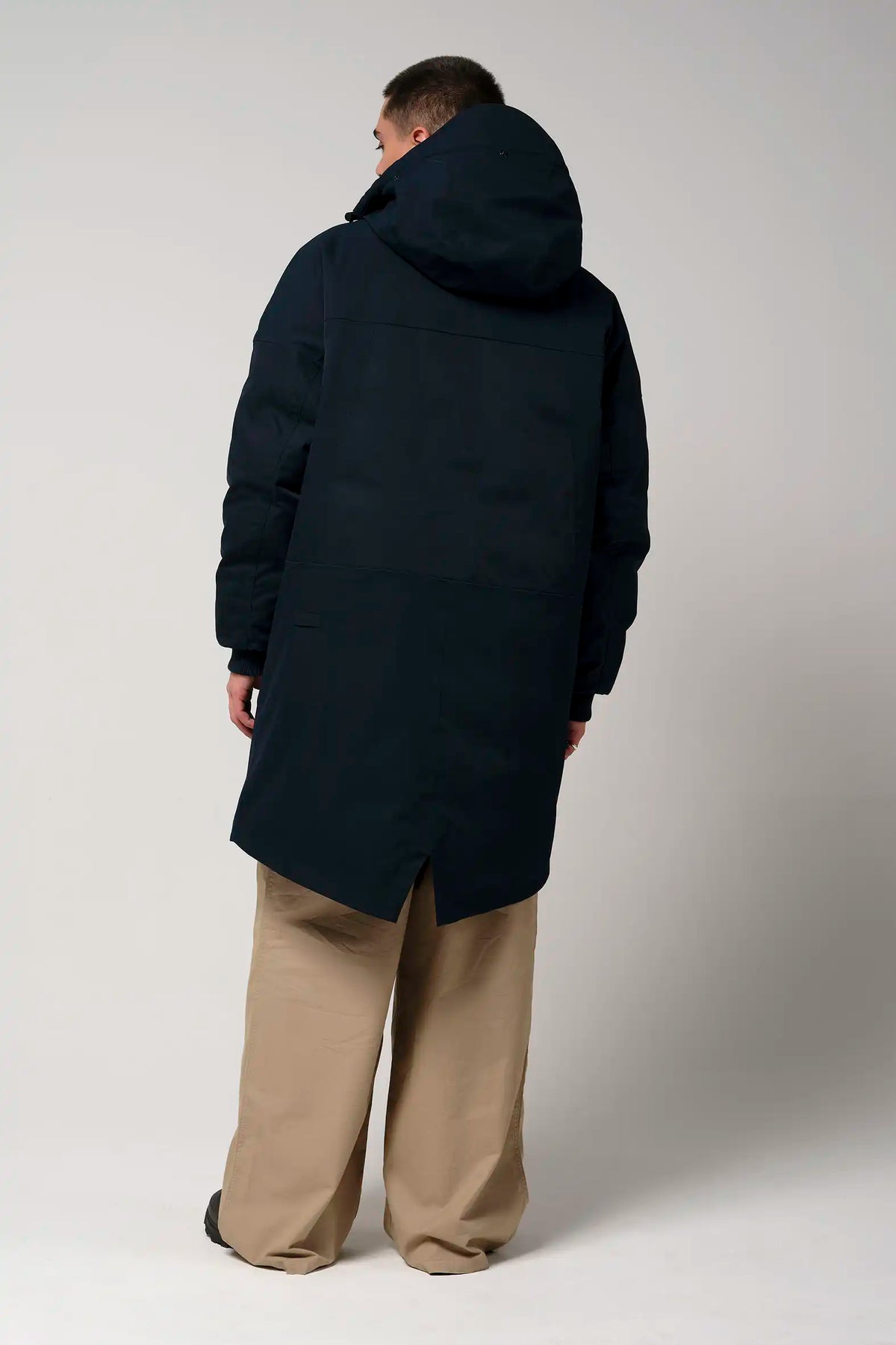 Stratus Sky Captain Blue Parka displayed from the back, showcasing its sleek design and adjustable hood.