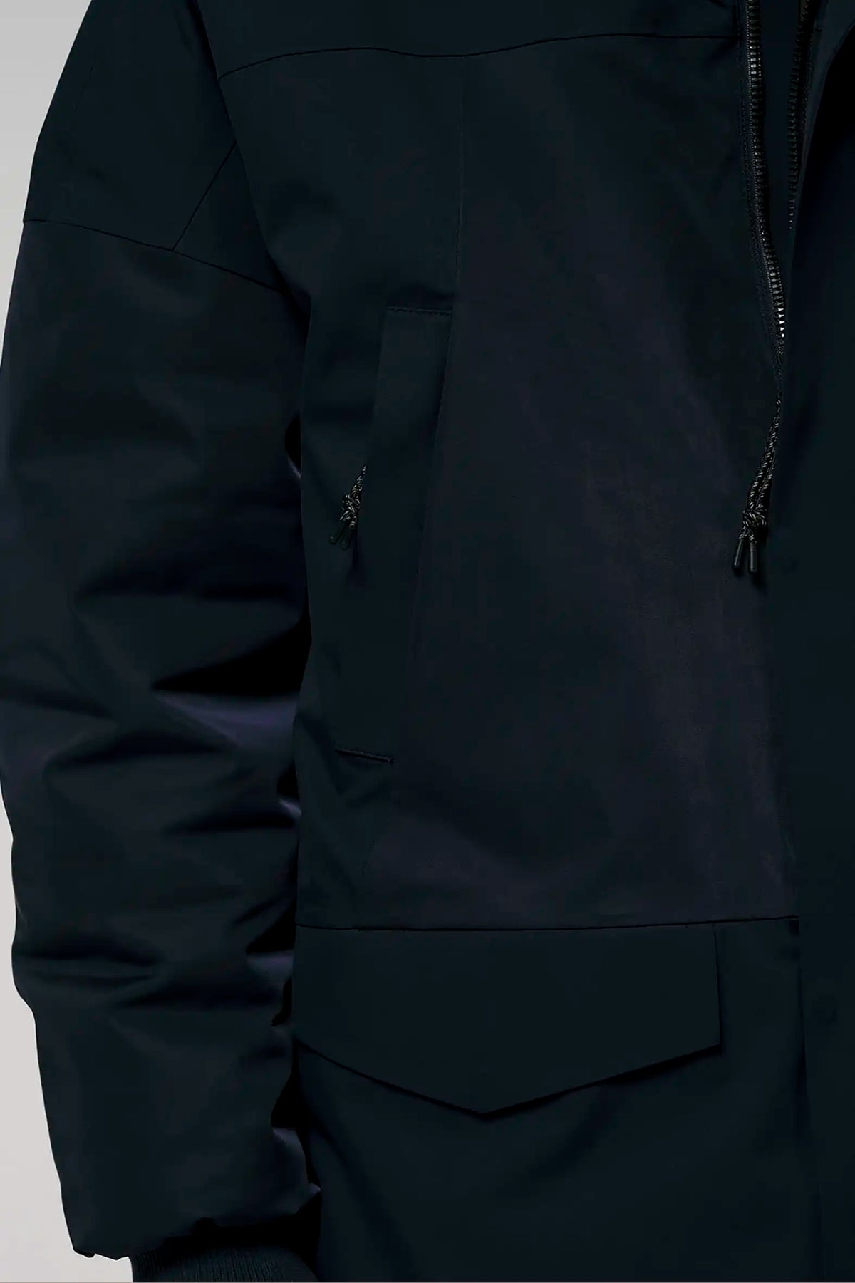 Close-up of the Stratus Sky Captain Blue Parka showcasing the fabric and pocket details.
