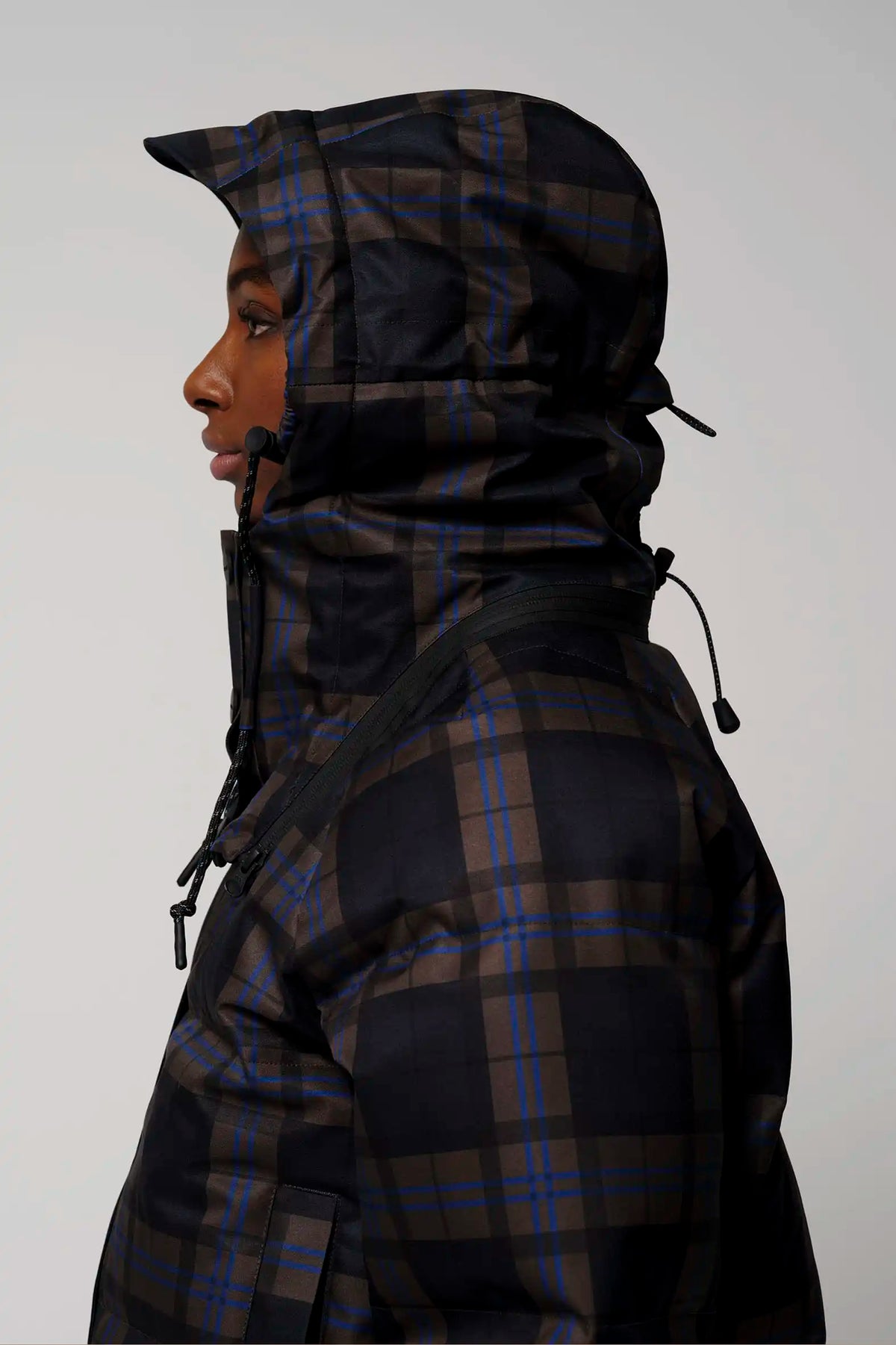 Talon Blue Tartan Check Coat side view showcasing adjustable hood and waterproof material.