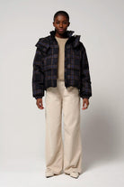 Talon Blue Tartan Check Coat worn by a model, showcasing waterproof and breathable features.