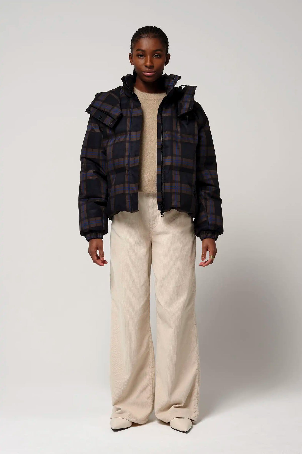Talon Blue Tartan Check Coat worn by a model, showcasing waterproof and breathable features.