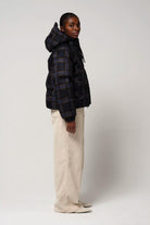 Talon Blue Tartan Check Coat showcased on model, featuring waterproof, breathable fabric and removable hood.