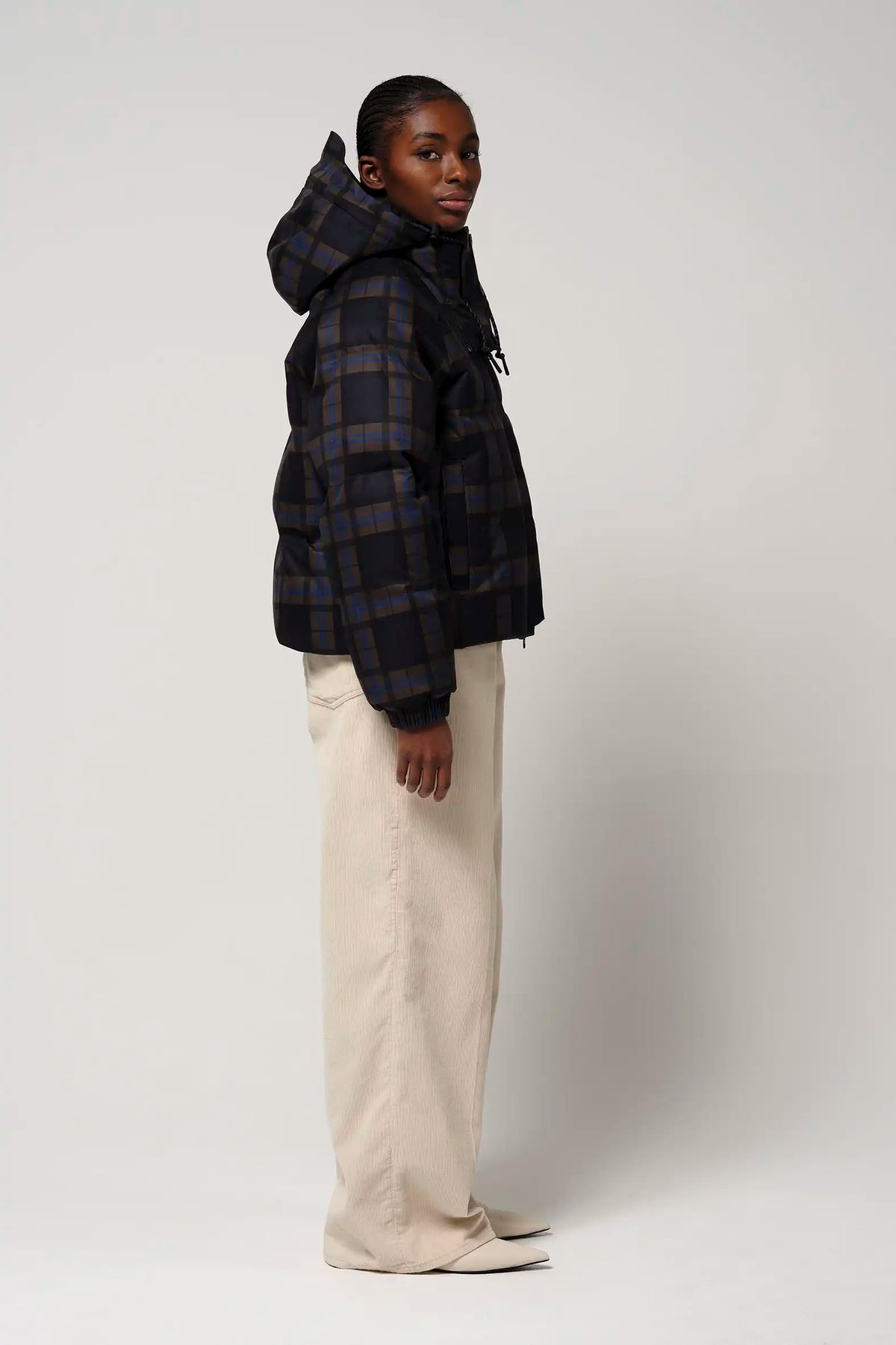 Talon Blue Tartan Check Coat showcased on model, featuring waterproof, breathable fabric and removable hood.