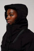 Model wearing Talon Deep Black Coat with adjustable hood and waterproof features.