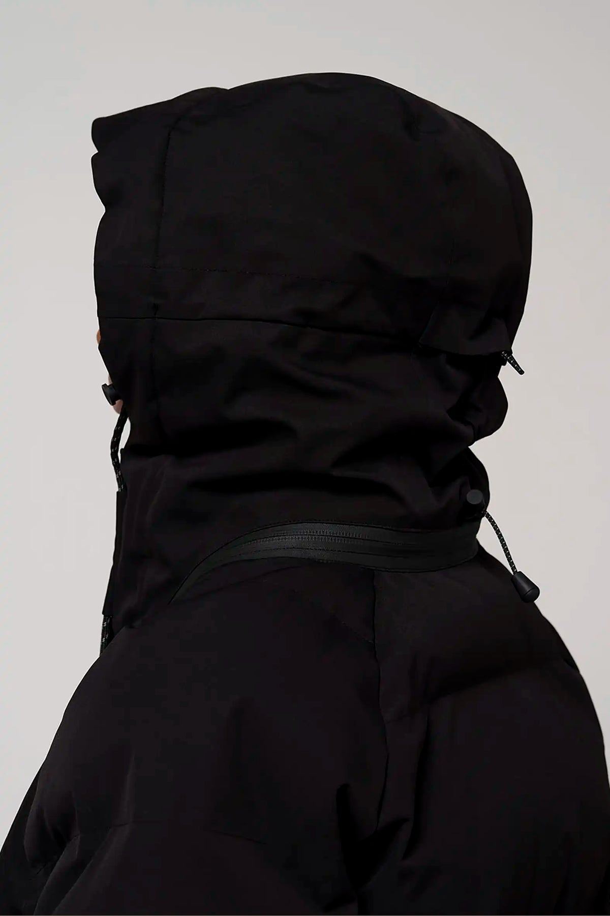 Talon Deep Black Coat with adjustable hood, showcasing waterproof and windproof features.