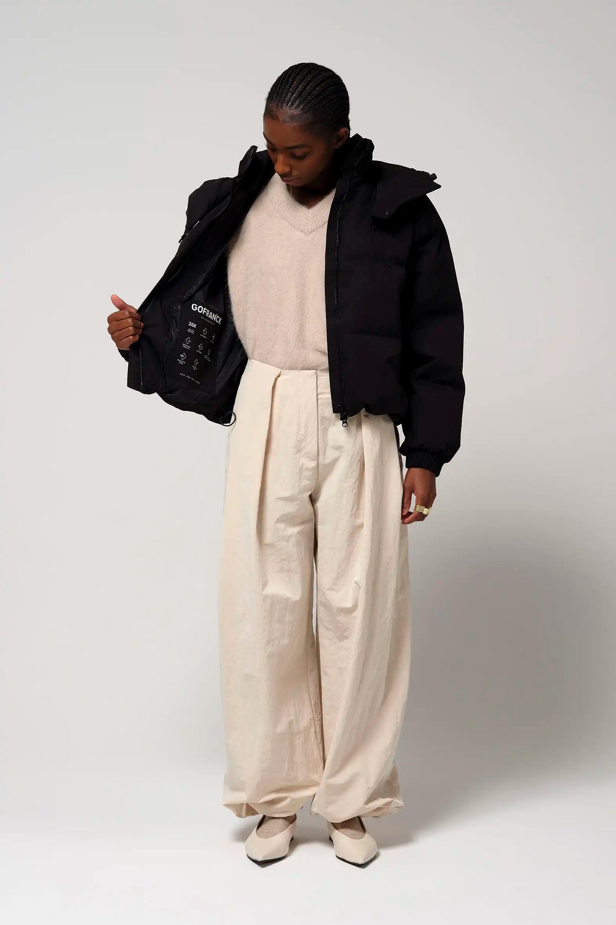 Model wearing Talon Deep Black Coat, showcasing its stylish design and comfortable fit.