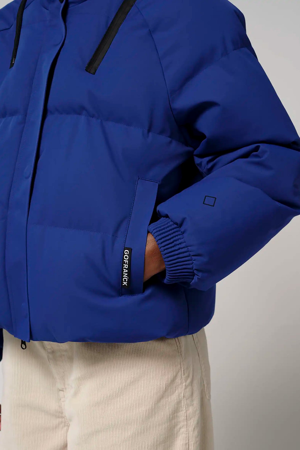 Talon Sodalite Blue Coat featuring a stylish design, adjustable hood, and durable material for outdoor performance.