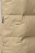 Tsunami Fields of Rye Beige Coat close-up showing lightweight puffer material and side zipper features.