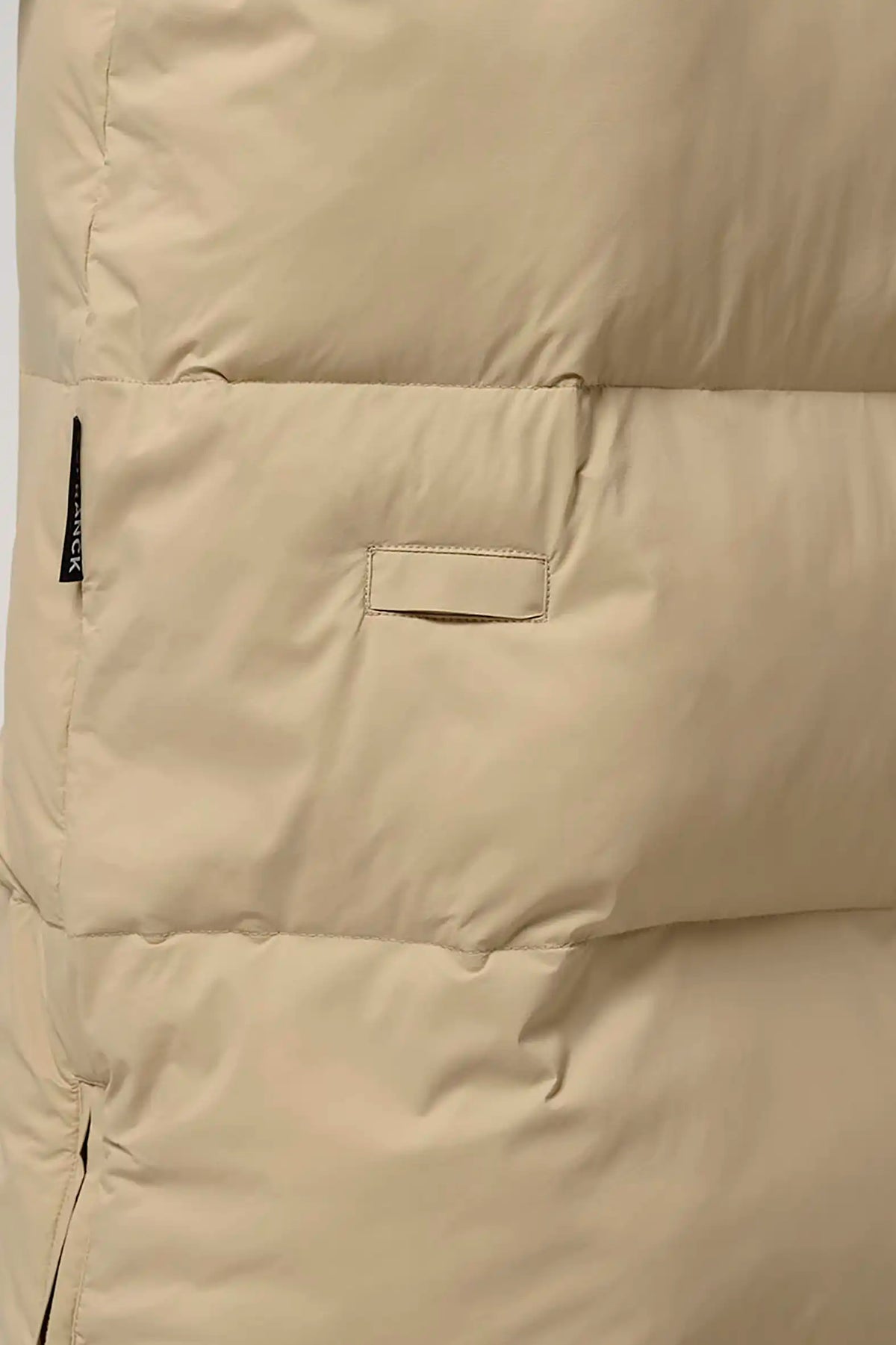 Tsunami Fields of Rye Beige Coat close-up showing lightweight puffer material and side zipper features.