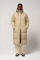 Tsunami Fields of Rye Beige Coat displayed on model, showcasing its lightweight, waterproof design and stylish fit.
