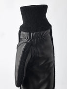 Jeanne Mitt Black Gloves by Hestra, featuring supple hairsheep nappa leather and warm wool cuffs, perfect for chilly weather.