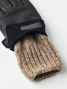 Tiril Black Gloves featuring supple deerskin leather and warm wool lining by Hestra, perfect for cold weather.