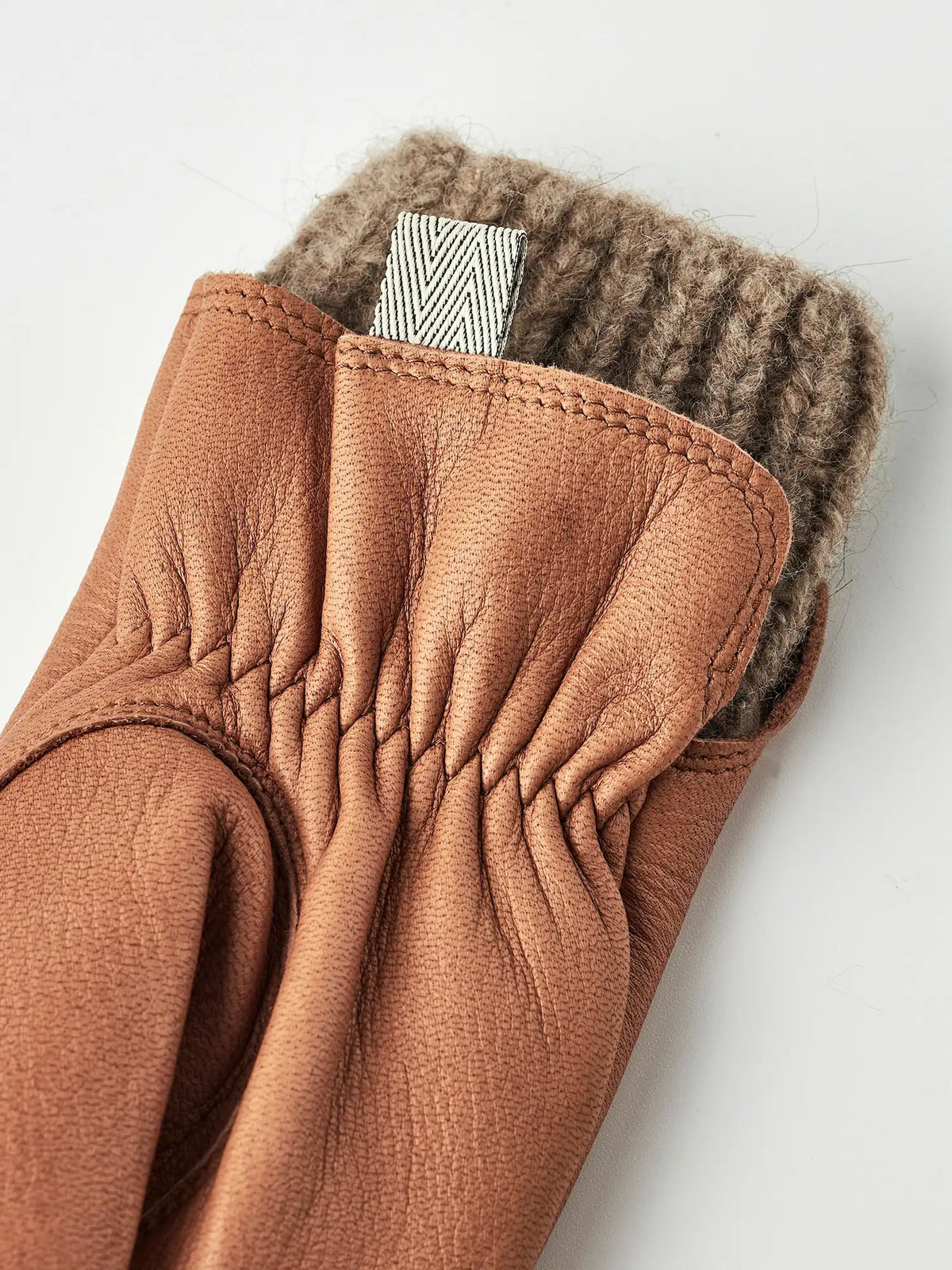 Tiril Cork Gloves by Hestra, featuring supple deerskin leather and soft wool lining, perfect for cold weather.