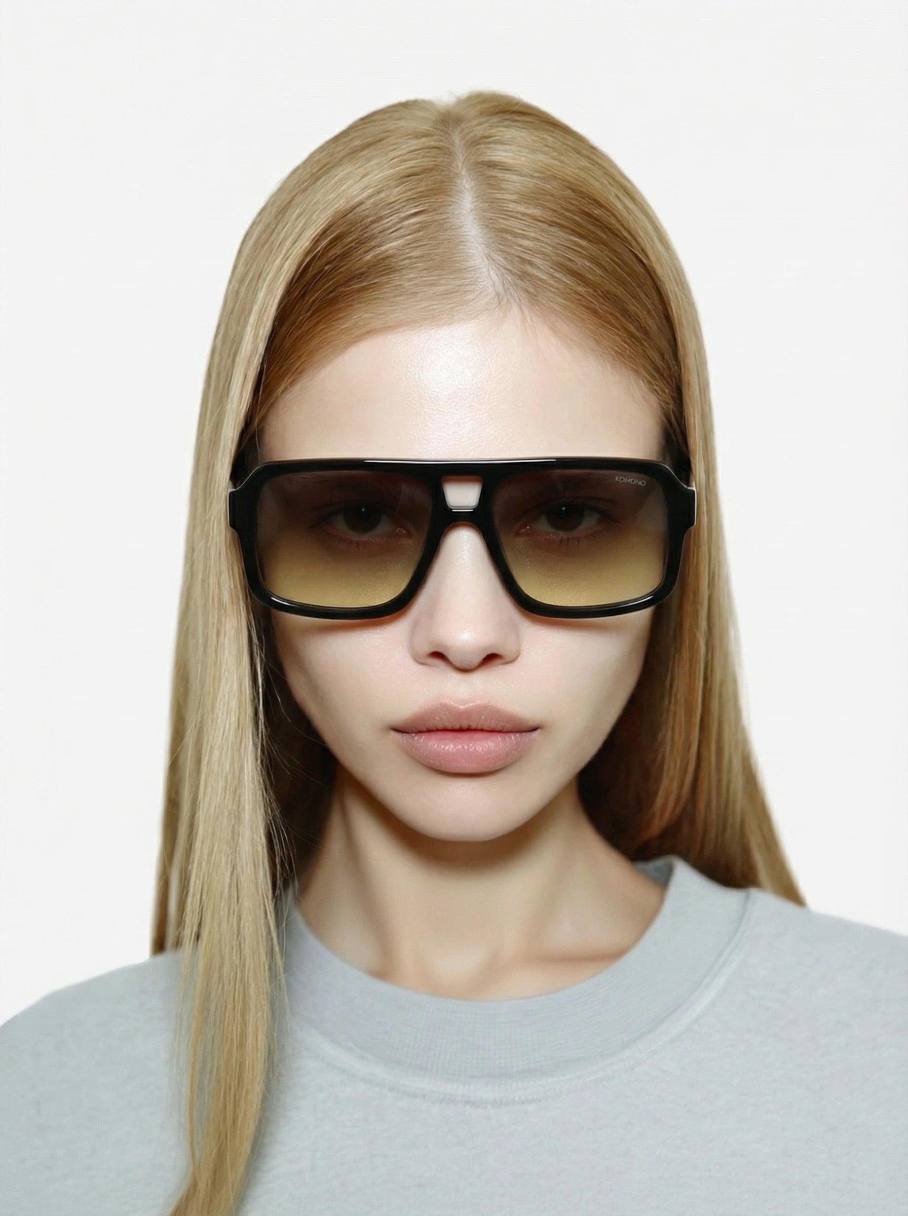 Falcon Black Meadow Sunglasses worn by a model, featuring a bold design and UV 400 protection.