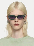 Person wearing Hayden Green Jungle Sunglasses with UV 400 protection and bio nylon frame.
