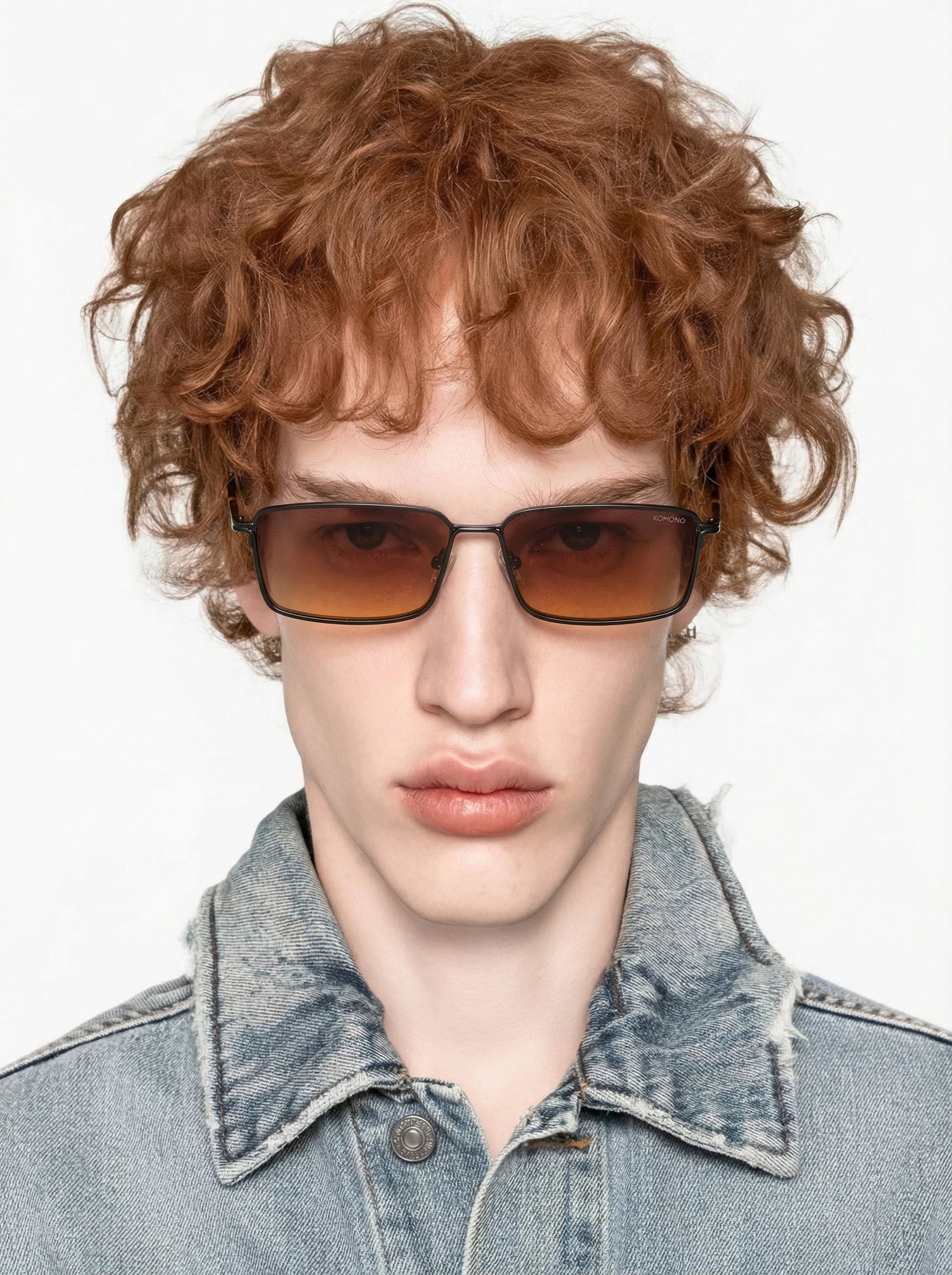Ryder Black Matte Sunglasses worn by a model with curly hair in a denim jacket.