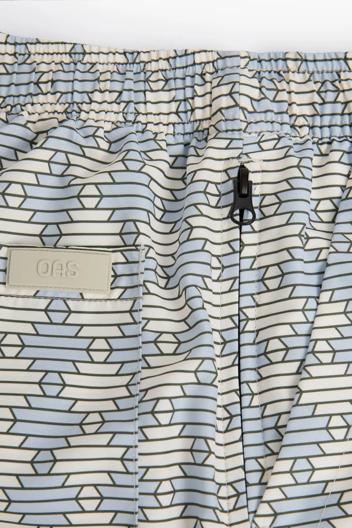 Forti Swim Shorts featuring lightweight design, elastic waist, and a hidden zip pocket for essentials.