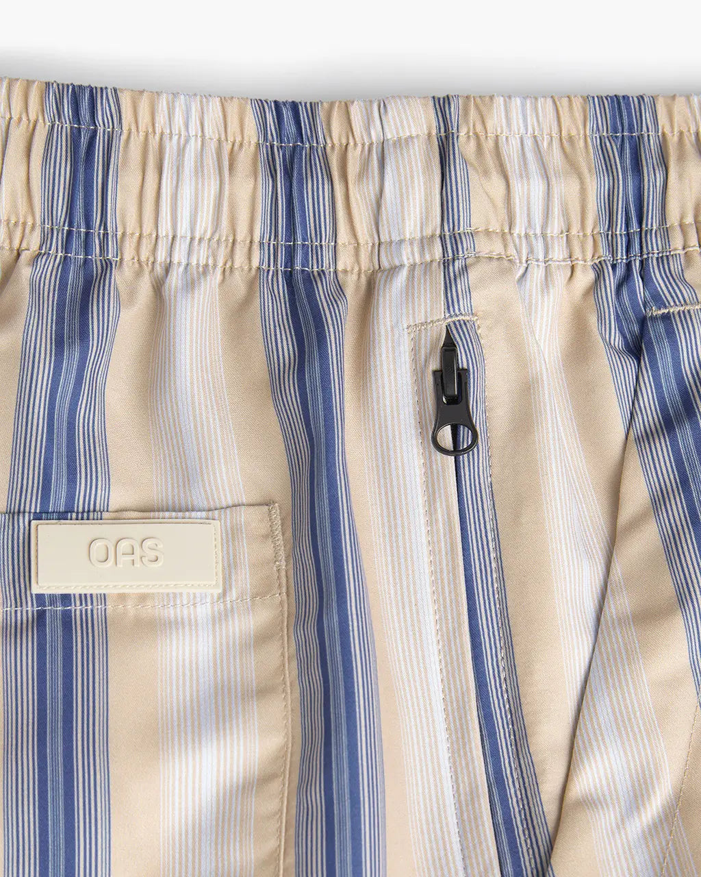 Gelato Swim Shorts featuring a lightweight design, elastic waist, and hidden zip pocket for convenience.