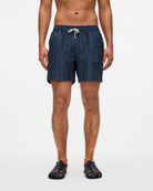 Model wearing Getrick Swim Shorts, lightweight and quick-drying with four pockets and elastic waist.