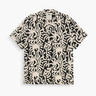 Loefy Rocco Shirt features a black and beige abstract pattern, perfect for warm weather and stylish relaxation.