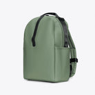 Clip Front Backpack Well Backpack in green, featuring waterproof material and side pockets for storage.