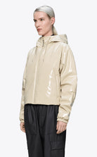 Lohja Short Insulated Jacket Shore Coat in beige, waterproof, lightweight, with padded hood and elastic cuffs.