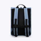 Back view of Rolltop Rucksack Blue Dusk Backpack showcasing padded straps and mesh support.
