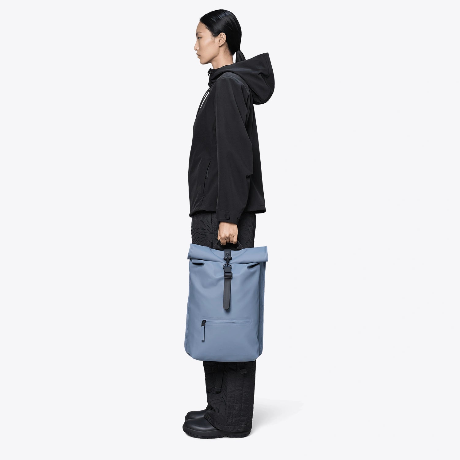 Rolltop Rucksack Blue Dusk Backpack shown in use, fully waterproof design with roll-top closure, stylish and functional.