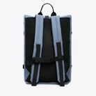 Back view of Rolltop Rucksack Large Blue Dusk Backpack with padded straps and breathable mesh.