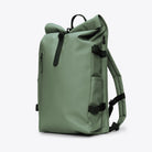 Rolltop Rucksack Large Well Backpack in green color with roll-top closure and side pockets.
