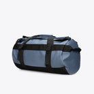 Texel Duffel Bag Small Blue Dusk Duffel Backpack side view, waterproof and adjustable straps, perfect for travel.