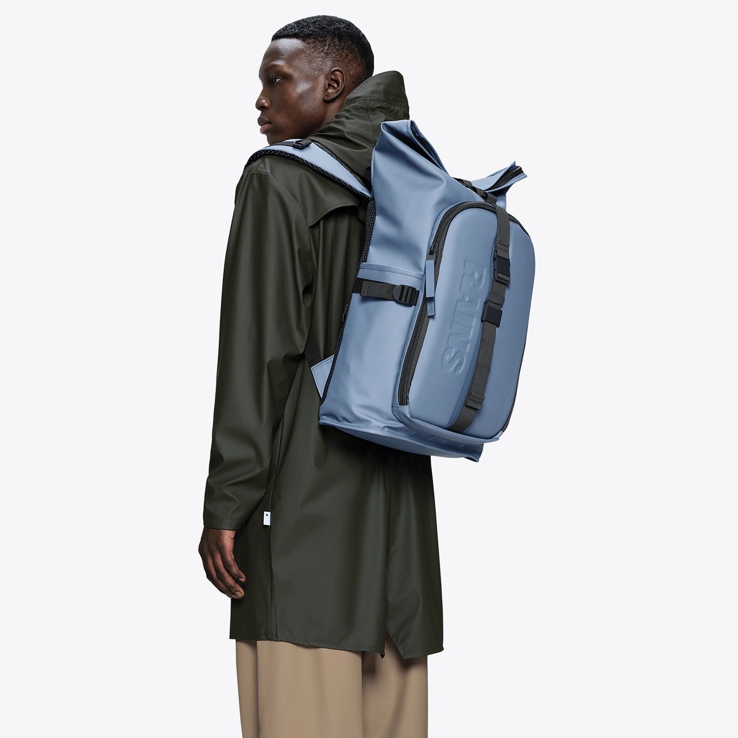 Texel Moulded Backpack Blue Dusk Backpack worn by a model, showcasing its waterproof design and modern style.